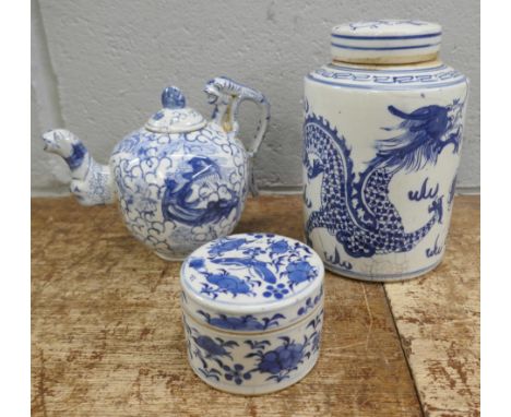 Three items of Chinese blue and white pottery; cylindrical tea caddy, a/f, tea pot and small lidded pot 