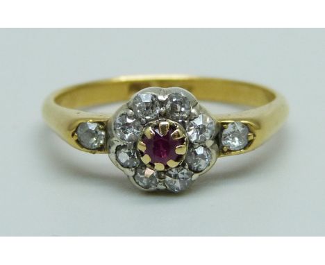 An 18ct gold, ruby and diamond cluster ring, 2.9g, O 