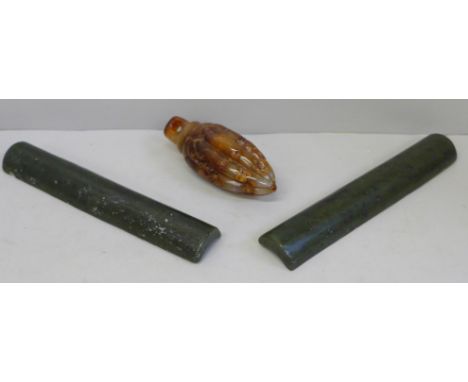 Two jade paperweights and a carved stone weight 