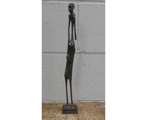 A bronze figure of an African tribesman 