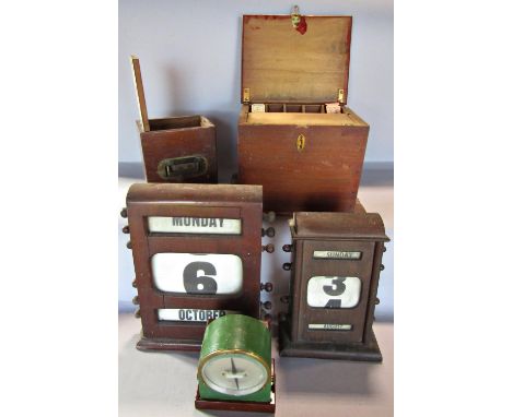 Two vintage mahogany desk top adjustable calendars, a wooden ticket dispenser with vintage tickets and an amp meter dated 191