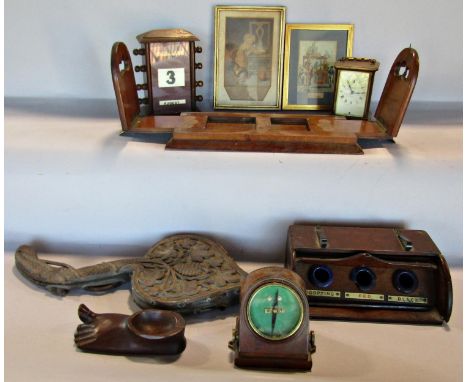 A patent Betjeman's oak adjustable book slide, (as found), an oak desk top adjustable calendar, a tambour fronted three pot i