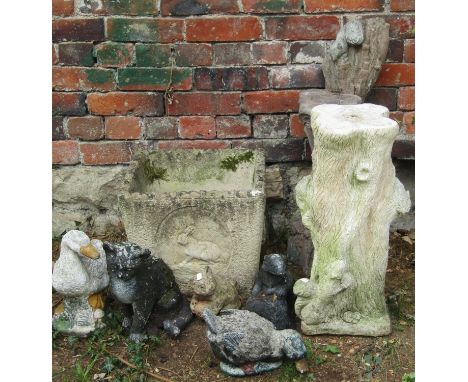 A weathered cast composition stone planter of square tapered form with rabbit, owl and hedgehog detail, 40 cm square approxim