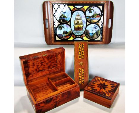 A walnut and maple wood jewellery box, a parquetry overlaid trinket box, a cribbage board and butterfly wing decorated tray. 