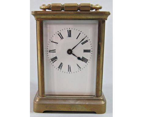 A simple brass carriage clock with eight day time piece 