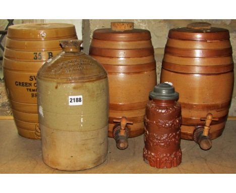 Two vintage two gallon glazed stoneware spirit barrels, together with further example with printed merchants marks for Swan's