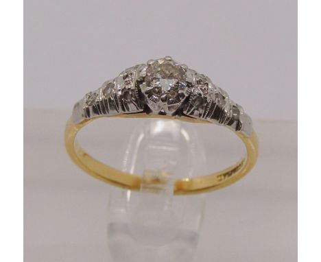 18ct platinum set diamond solitaire ring with further diamonds to the shoulders, centre stone 0.20cts approx, size L, 2.6g 