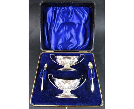 A cased set of late Victorian silver gilt Adam style salt urns with spoons, Birmingham 1897, maker S. Blankensee &amp; son Lt