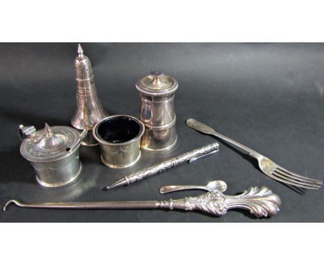 A silver three piece condiment set, salt, pepper and mustard with two separate spoons, (only one blue glass liner) set on a m