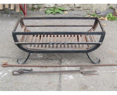 A cast iron fire basket of rectangular form, together with three fire tools, 62 cm wide x 30 deep x 25 cm high 