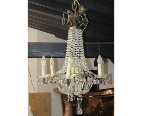 A gilt framed six branch chandelier, festooned with faceted drops, 80 cm drop approximately 