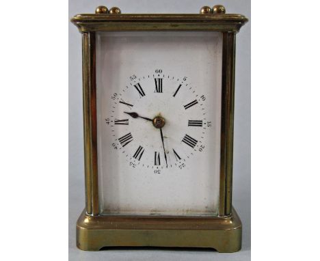 A simple brass carriage clock with eight day time piece 