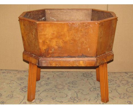 A yew wood veneered planter/wine cooler in the Georgian style of elongated octagonal form 55 cm x 40 cm x 49 cm high 