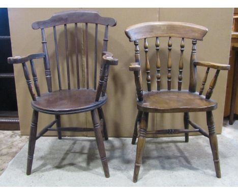 A Swedish stained elm and  beechwood stick back elbow chair with circular seat, together with two others (3) 