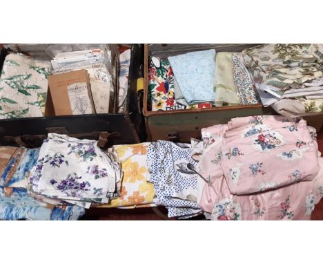 Two large trunks containing a quantity of vintage fabric curtains and remnants  including 'Potpourri' pattern cotton curtains