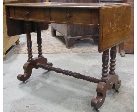 A 19th century mahogany drop leaf sofa table with moulded outline over two frieze drawers raised on ring turned tapered and s