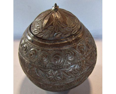 A 19th century coconut tea caddy, geometrical and floral carved and incised decoration, (loose lid and lacks base) 