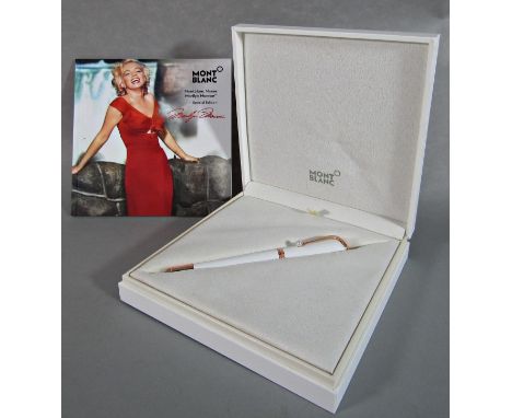 A Mont Blanc Muses Marilyn Monroe's special collection pearl coloured rollerball pen, with box and book (unused) 