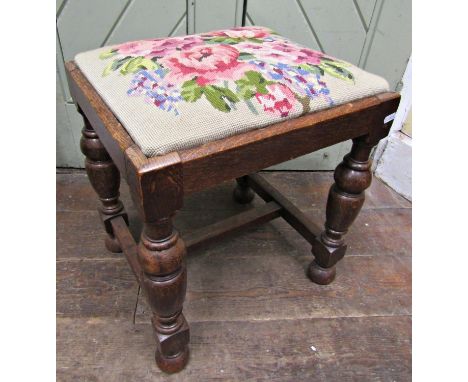 An old English style oak stool, with hand worked tapestry top 
