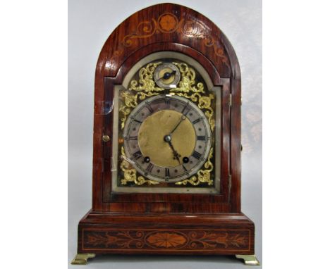 An Edwardian inlaid rosewood bracket clock with arched case, dial in brass with silvered chapter ring, regulator and two trai