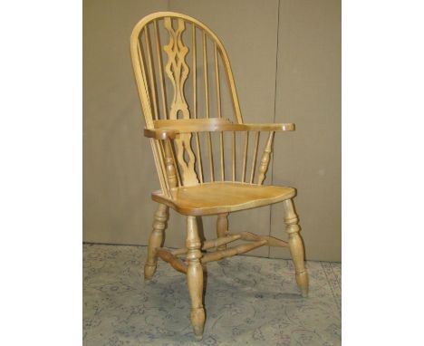 A modern Windsor beechwood hoop and stick back elbow chair together with a vintage oak sewing/work box with hinged lid over a