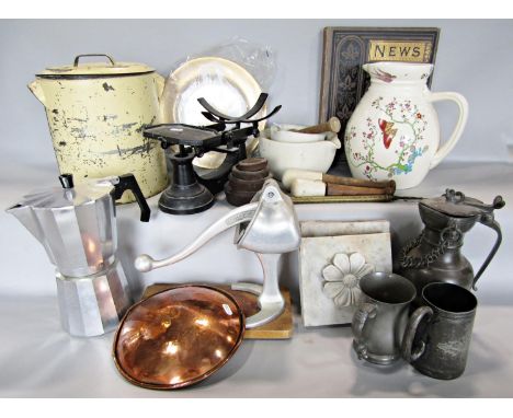 Kitchenalia comprising an enamel bread bin, a table top mince press, pestles and mortars, weighing scales and weight, an Orol