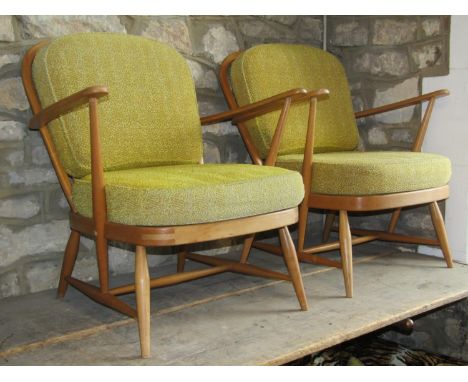 A pair of vintage light Ercol low Windsor style hoop and stick back open elbow chairs 