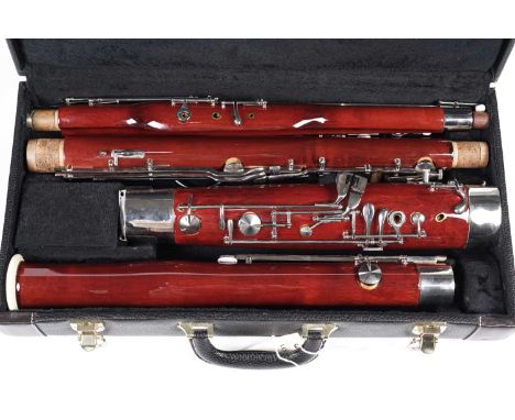 A Sterling student bassoon, with chromium plated keys, in plush lined hard carry case.