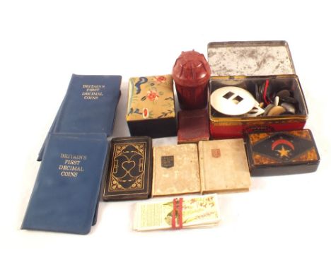 A Victorian papier mache Turkish market snuff box, miniature books and coins etc