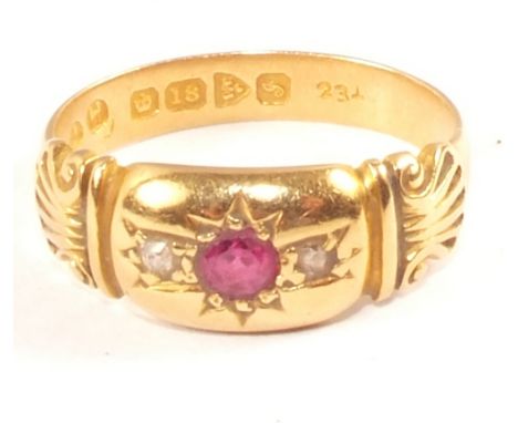 An 18ct Gold Ruby and Diamond set ring with shell shaped shoulders, size J