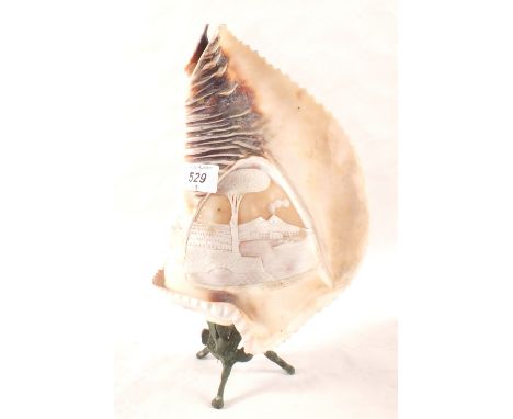 A carved cameo shell lamp