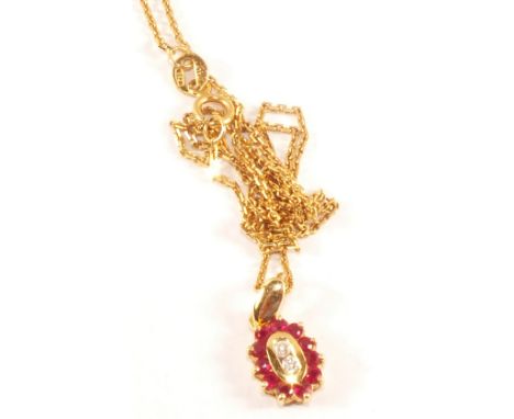An 18ct Gold Ruby and Diamond set pendant on 18ct Gold chain