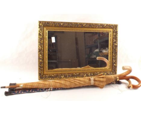 A table lamp, various light fittings, gilt wall mirror, sticks and brollies
