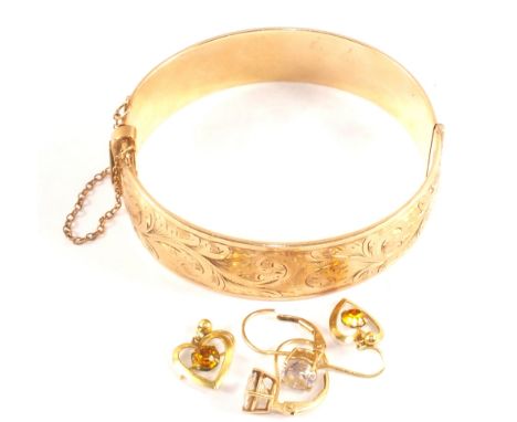 A 9ct Gold metal core bangle with a pair of 14ct Gold white stone earrings plus a pair of 9ct Gold paste set earrings