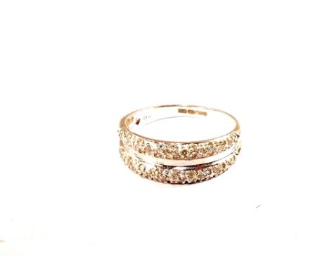 An 18ct White Gold Diamond set band ring, size R