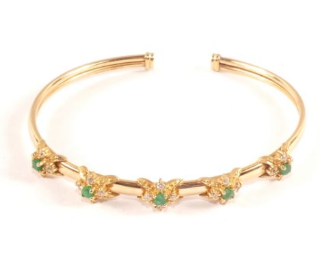 A 9ct Gold Emerald and white stone bangle (wire core)