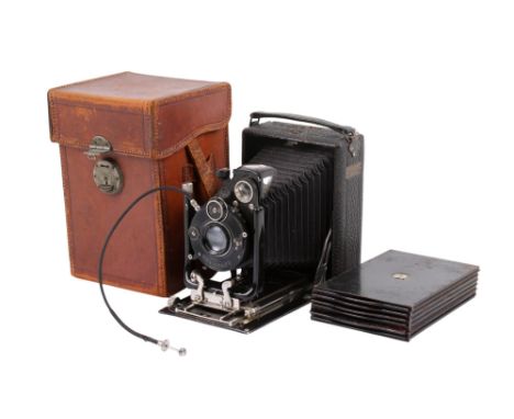 A Sands Hunter quarter-plate large format camera. With Compur shutter and Carl Zeiss Jena 13.5cm f6.3 Triotar lens. Together 
