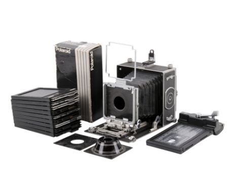 An M.P.P. 5 x 4 Micro Technical camera body. With a ground glass focusing screen, three lens boards, nine film holders, and a