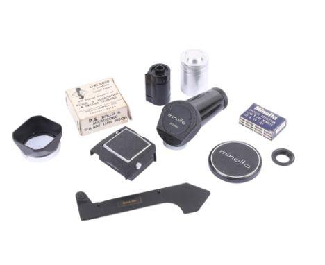 A small assortment of photographic accessories. To include a Leitz-style film leader trimmer guide, a reloadable 35mm caniste