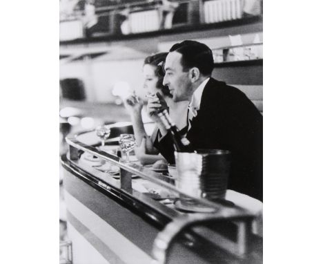 A black and white silver gelatin resin photograph of 'Dining Out'. By an unknown photographer from the 1950s, depicting diner