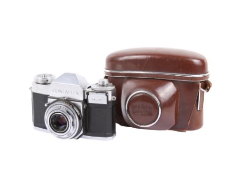 A Zeiss Ikon Contaflex 35mm SLR camera. Chrome. With a Carl Zeiss 45mm f2.8 Tessar lens and ERC. Shutter  working and light m