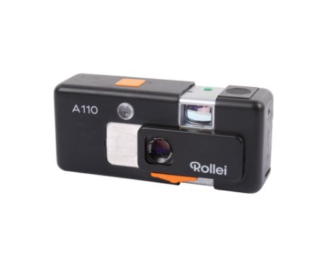 A Rollei Germany A110 Sub-Miniature camera. Serial Number 3080598. With a Tessar 23mm f2.8 lens, key chain and pouch. Shutter