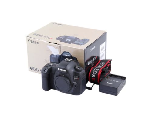 A Canon EOS 5DSR Digital SLR camera body. Serial number 028021001528. With battery, charger, cap, strap, instruction manual, 