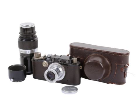 A Leitz Wetzlar Leica III 35mm Rangefinder camera outfit. Black and chrome body. 1934. Serial number 145704. Upgraded from a 