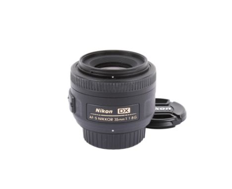 A Nikon AF-S Nikkor 35mm f1.8 G DX lens. With front and rear caps. Excellent optical and cosmetic condition. Appears to funct