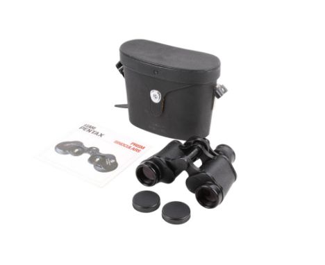 A pair of Asahi Pentax prism binoculars. 8x30 field 7.5 degree, numbered 4906687, with instruction booklet and fitted case. 