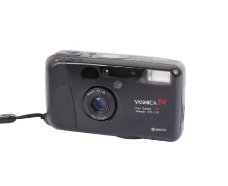 A Yashica T4 35mm compact camera. Serial Number 588928. With a Carl Zeiss T* 35mm f3.5 Tessar lens and wrist strap. Powers on