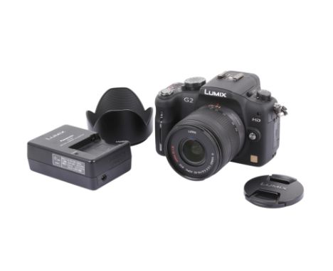 A Panasonic Lumix G2 Digital Mirrorless camera. With a Lumix 14-42mm f3.5-5.6 G Vario lens, optics VG, battery, charger, lens