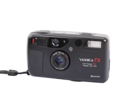 A Yashica T5 35mm compact camera. Serial Number 116076. With a Carl Zeiss T* 35mm f3.5 Tessar lens, pouch, wrist strap and in