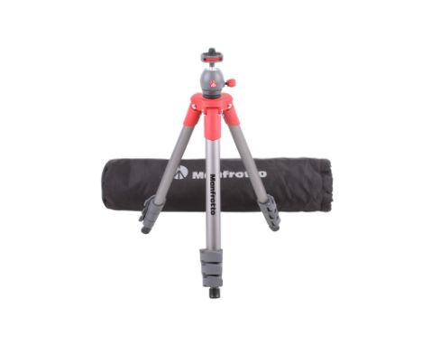 A Manfrotto Compact Light camera tripod. Serial number T0544698. With carry bag. 